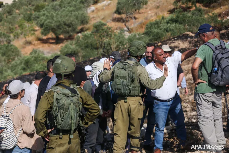 Israeli forces prevent a protest against settlement by Palestinian and foreign activists near outpost of Givat Ronen in Burin village, near the West Bank city of Nablus, on June 17, 2022. Photo by Shadi Jarar'ah