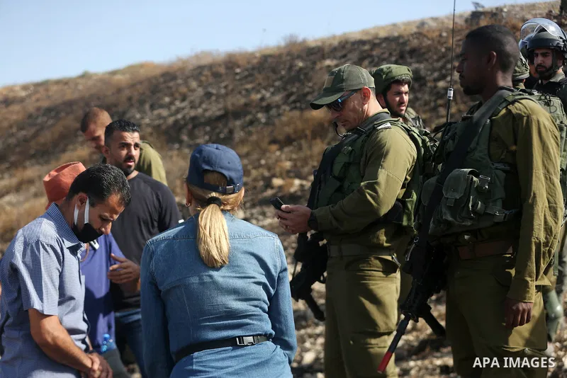 Israeli forces prevent a protest against settlement by Palestinian and foreign activists near outpost of Givat Ronen in Burin village, near the West Bank city of Nablus, on June 17, 2022. Photo by Shadi Jarar'ah