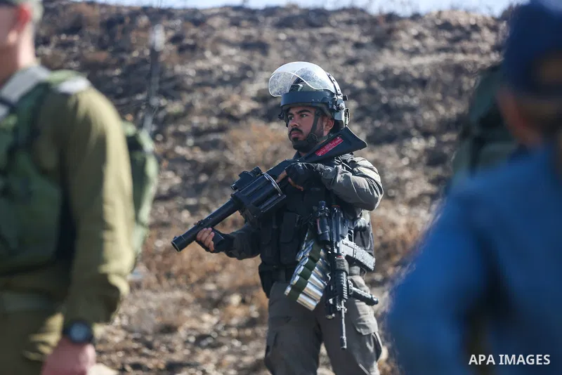 Israeli forces prevent a protest against settlement by Palestinian and foreign activists near outpost of Givat Ronen in Burin village, near the West Bank city of Nablus, on June 17, 2022. Photo by Shadi Jarar'ah