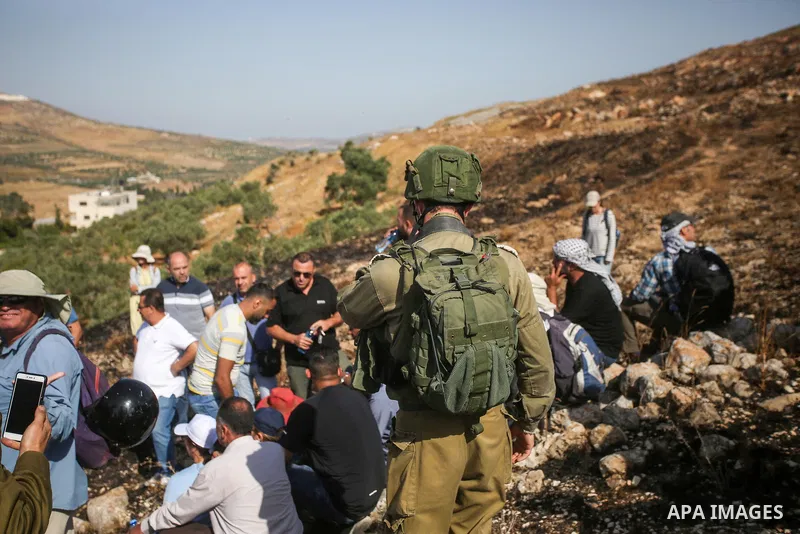 Israeli forces prevent a protest against settlement by Palestinian and foreign activists near outpost of Givat Ronen in Burin village, near the West Bank city of Nablus, on June 17, 2022. Photo by Shadi Jarar'ah
