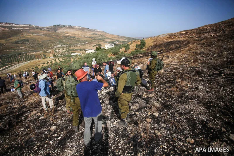Israeli forces prevent a protest against settlement by Palestinian and foreign activists near outpost of Givat Ronen in Burin village, near the West Bank city of Nablus, on June 17, 2022. Photo by Shadi Jarar'ah