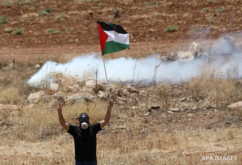 Palestinian protesters clash with Israeli forces during a demonstration against settlements in the village of Beit Dajan, near the West Bank city of Nablus on June 17, 2022. Photo by Wajed Nobani