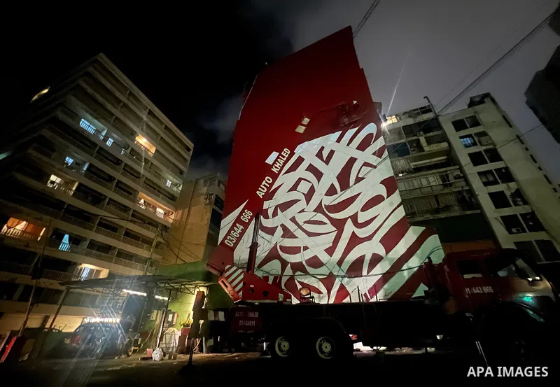 Palestinian artist Bilal Khaled draws on a wall a graffiti mural in Beirut on June 19, 2022. Photo by Nidal Al-Wahidi