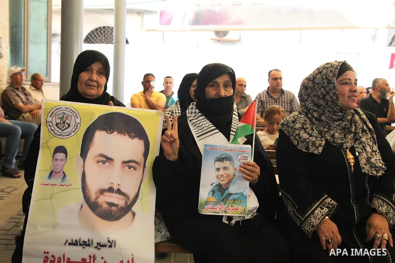 Palestinians take part in a protest to show solidarity with prisoners on hunger strike held in Israeli jails, in front of Red cross office in Gaza city, on June 20, 2022. Six Palestinian freedom fighters in Israeli priso...