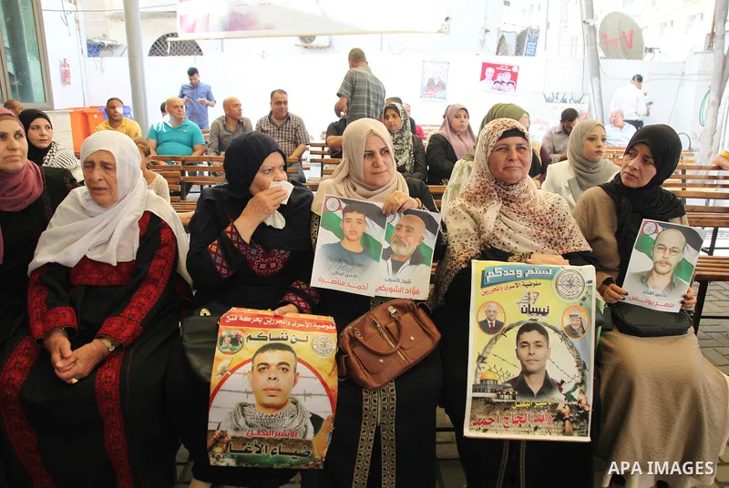 Palestinians take part in a protest to show solidarity with prisoners on hunger strike held in Israeli jails, in front of Red cross office in Gaza city, on June 20, 2022. Six Palestinian freedom fighters in Israeli priso...