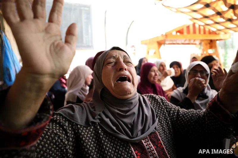Mourners attend the funeral of Palestinian Ali Harb, who was killed by an Israeli settler in the northern West Bank village of Iskaka, on June 22, 2022. An Israeli settler stabbed a Palestinian to death in the West Bank...
