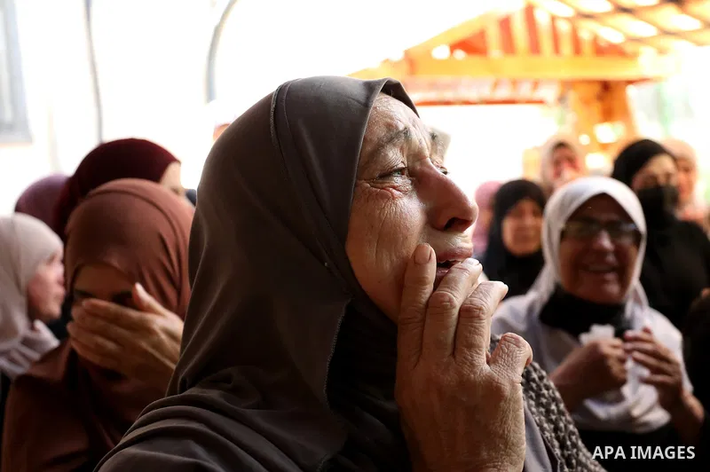 Mourners attend the funeral of Palestinian Ali Harb, who was killed by an Israeli settler in the northern West Bank village of Iskaka, on June 22, 2022. An Israeli settler stabbed a Palestinian to death in the West Bank...