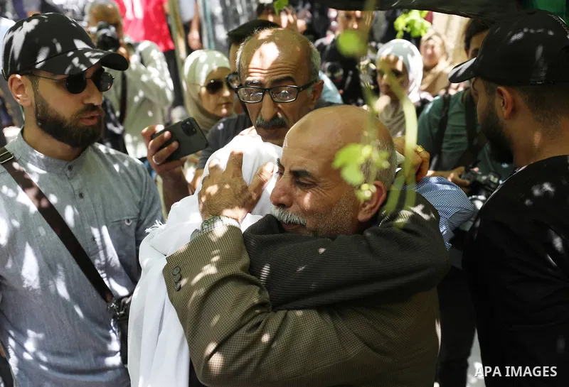Mourners attend the funeral of Palestinian Ali Harb, who was killed by an Israeli settler in the northern West Bank village of Iskaka, on June 22, 2022. An Israeli settler stabbed a Palestinian to death in the West Bank...