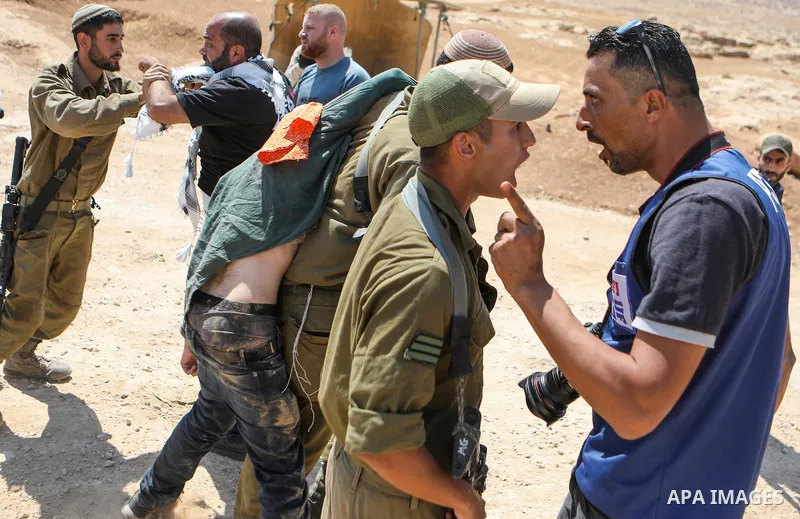 Israeli soldiers clash with Palestinian activists during a protest against the Israeli military drill, in Masafer Yatta, south of Hebron, in the West Bank on June 22, 2022. Recently, Israeli High Court decided that appro...