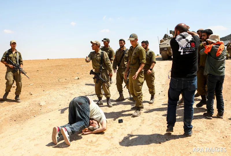 Israeli soldiers clash with Palestinian activists during a protest against the Israeli military drill, in Masafer Yatta, south of Hebron, in the West Bank on June 22, 2022. Recently, Israeli High Court decided that appro...