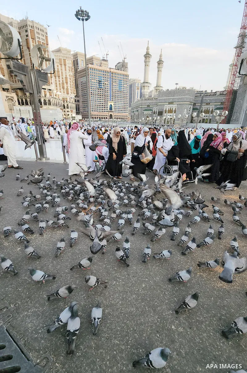 Muslim pilgrims walk during the annual Haj pilgrimage, in the holy Saudi city of Mecca, on June 23, 2022. Annual Saudi Arabia welcomed its first batch of hajj pilgrims since before the coronavirus pandemic, which prompte...