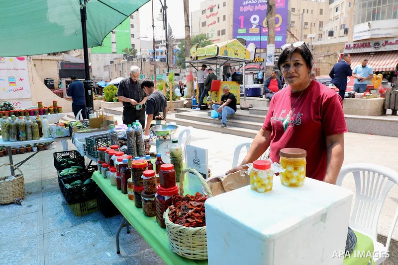 Palestinians attend the farmers market in the West Bank city of Ramallah, on June 25, 2022. Photo by Wajed Nobani