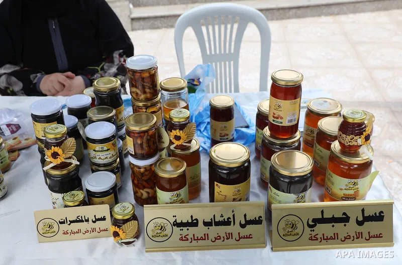 Palestinians attend the farmers market in the West Bank city of Ramallah, on June 25, 2022. Photo by Wajed Nobani