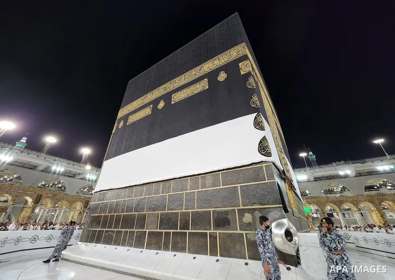 Saudi security men stand guard around the "Black Stone", set into the eastern corner of the Kaaba, at the Grand Mosque complex in the Saudi holy city of Mecca, during annual Hajj pilgrimage on June 27, 2022. Annual Saudi...