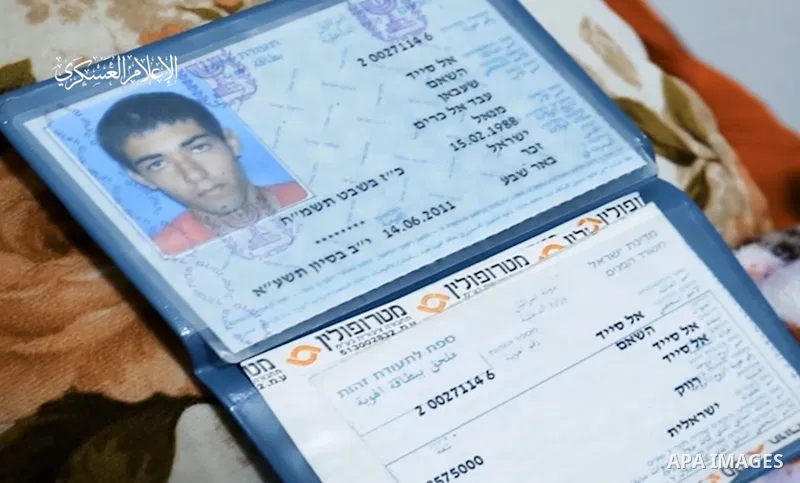 Picture taken from video released by Al-Qassam Brigades on June 28, 2022 shows, the ID of Israeli detained by the Al-Qassam Brigades, the military wing of Hamas, Hisham al-Sayed. Hamas’s military wing on Monday night tha...