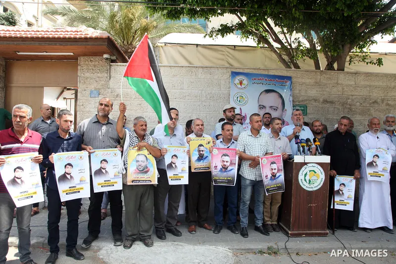 Palestinians take part in a protest to show solidarity with prisoners held in Israeli jails, in front of Red cross office in Gaza city, on July 06, 2022. According to the latest figures from Addameer, the Palestinian Pri...