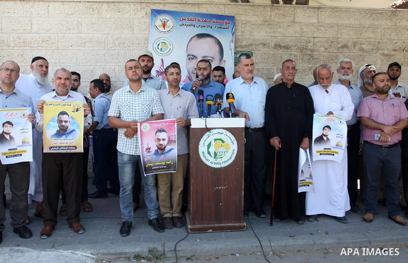 Palestinians take part in a protest to show solidarity with prisoners held in Israeli jails, in front of Red cross office in Gaza city, on July 06, 2022. According to the latest figures from Addameer, the Palestinian Pri...