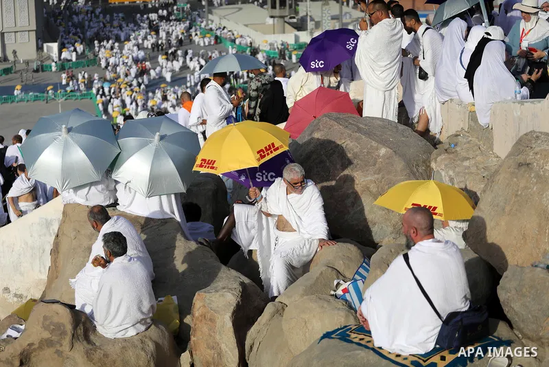 Muslim pilgrims pray on Mount Arafat, as Jabal al-Rahma near Mecca, as they take part in one of the Hajj rituals southeast of the Saudi holy city of Mecca on July 8, 2022. Arafat is the site where Muslims believe the Pro...
