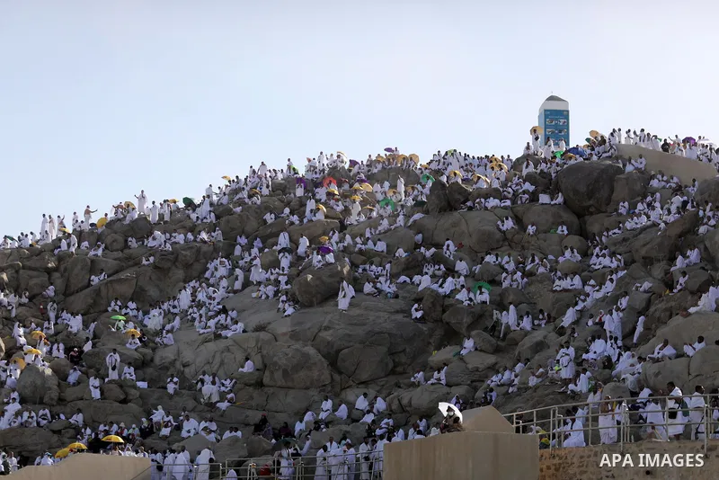 Muslim pilgrims pray on Mount Arafat, as Jabal al-Rahma near Mecca, as they take part in one of the Hajj rituals southeast of the Saudi holy city of Mecca on July 8, 2022. Arafat is the site where Muslims believe the Pro...