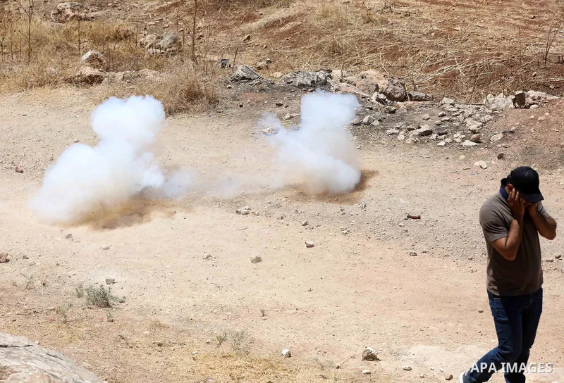 Palestinian protesters clash with Israeli forces during a demonstration against settlements in the village of Beit Dajan in the West Bank on July 8, 2022. Photo by Wajed Nobani
