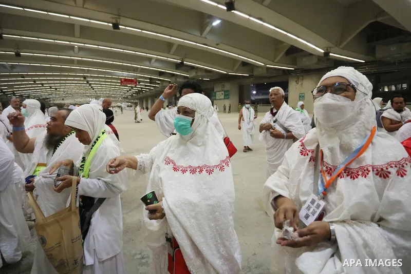 Muslim worshippers cast stones as part of a symbolic stoning of the devil ritual, during the Hajj pilgrimage in Mina, near Saudi Arabia's holy city of Mecca on July 09, 2022. From first light, small groups of pilgrims ma...