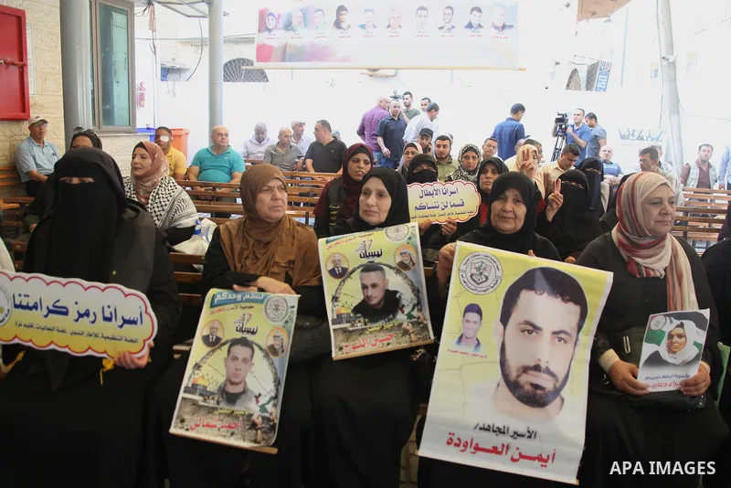 Palestinians take part in a protest to show solidarity with prisoners held in Israeli jails, in front of Red cross office in Gaza city, on July 18, 2022. According to the latest figures from Addameer, the Palestinian Pri...