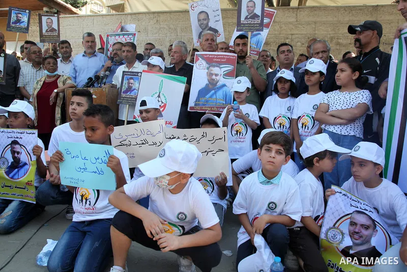 Palestinians take part in a protest to show solidarity with prisoners held in Israeli jails, in front of Red cross office in Gaza city, on July 18, 2022. According to the latest figures from Addameer, the Palestinian Pri...