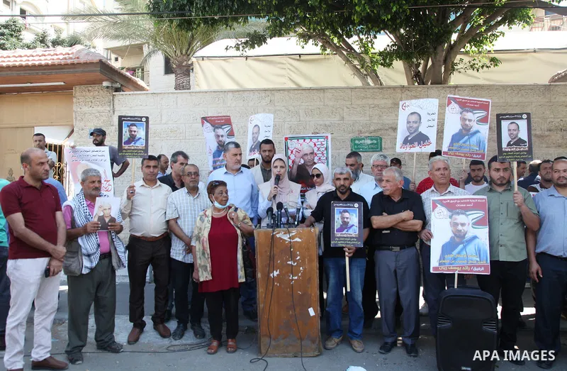 Palestinians take part in a protest to show solidarity with prisoners held in Israeli jails, in front of Red cross office in Gaza city, on July 18, 2022. According to the latest figures from Addameer, the Palestinian Pri...