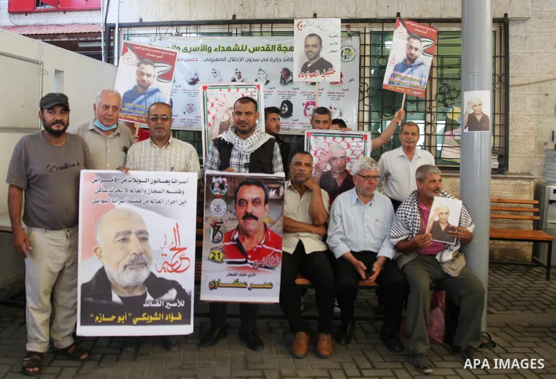 Palestinians take part in a protest to show solidarity with prisoners held in Israeli jails, in front of Red cross office in Gaza city, on July 18, 2022. According to the latest figures from Addameer, the Palestinian Pri...