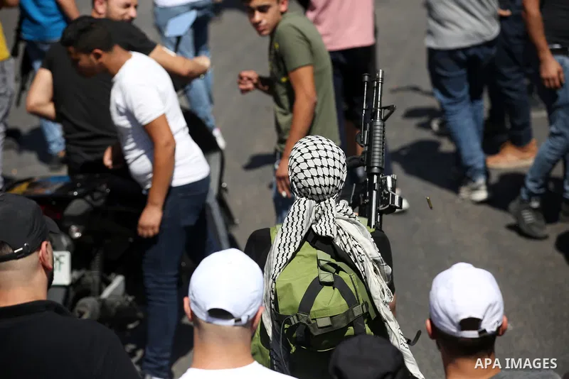 Mourners carry the bodies of two Palestinians who were killed by Israeli forces, during their funeral, in the West Bank city of Nablus on July 24, 2022. Two Palestinians were shot dead last night and ten others wounded,...
