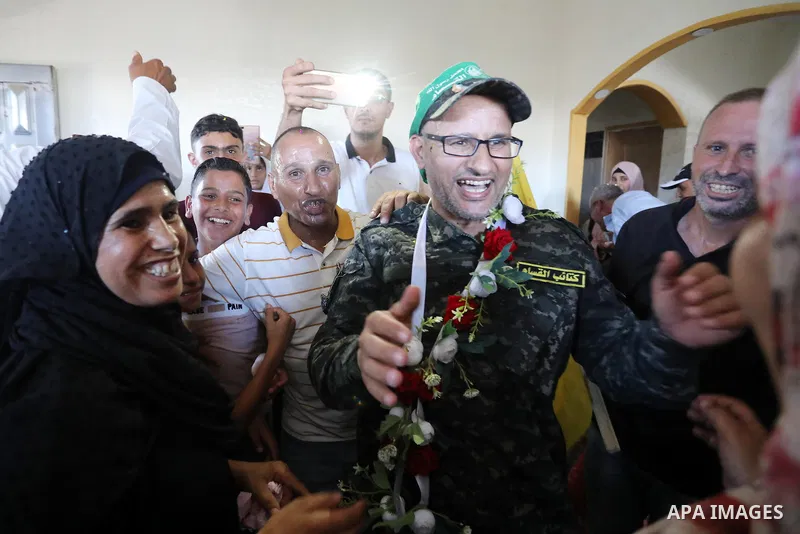 Palestinian prisoner Ashraf Abu Moghasib, who spent 20 years in Israeli jails is greeted by his relatives and friends upon his release in Deir al-Balah in the center of Gaza strip on July 31, 2022. Photo by Ashraf Amra