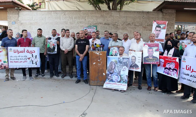 Palestinians take part in a protest in solidarity with Khalil Awawdeh, 40, has been on hunger strike in front of the headquarters of the Red Cross in Gaza City, on on August 1, 2022. Palestinian detainee Khalil Awawdeh,...