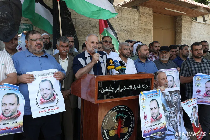 Palestinian supporters of the Islamic Jihad Movement take part in a protest in solidarity with Khalil Awawdeh, 40, has been on hunger strike in front of the headquarters of the Red Cross in Gaza City, on on August 1, 202...
