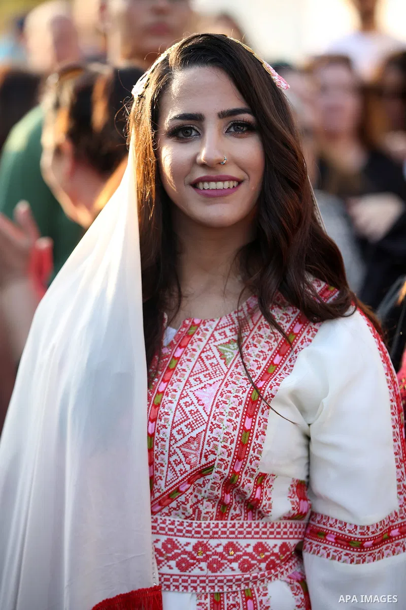 A Palestinian bride is dressed in a traditional outfit on her wedding day during the Palestinian Heritage Week in the town of Birzeit near the West Bank city city of Ramallah, on August 3, 2022. One of the most distincti...