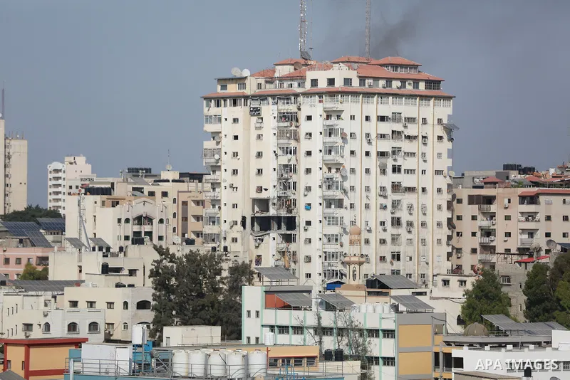 Smoke rises from a building following an Israeli air strike on Gaza City on August 5, 2022. The Israeli military said today it launched air strikes on Gaza, which were witnessed by Palestinians in central Gaza City. Phot...