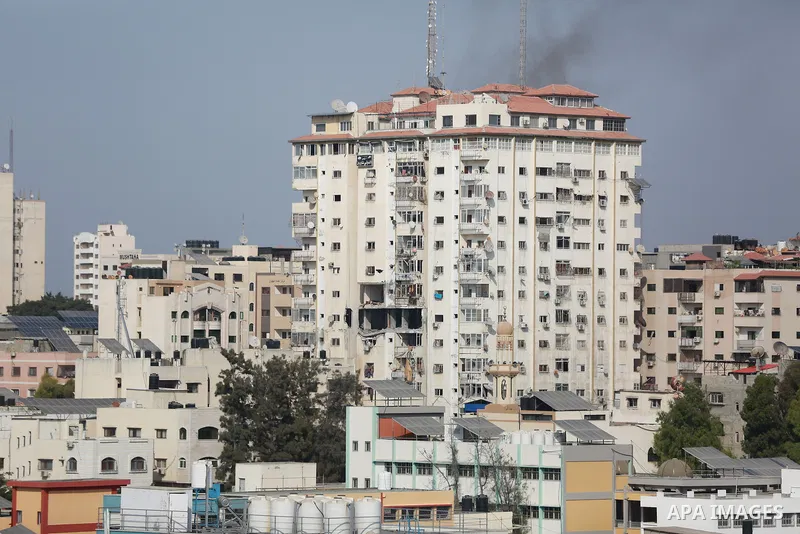 Smoke rises from a building following an Israeli air strike on Gaza City on August 5, 2022. The Israeli military said today it launched air strikes on Gaza, which were witnessed by Palestinians in central Gaza City. Phot...