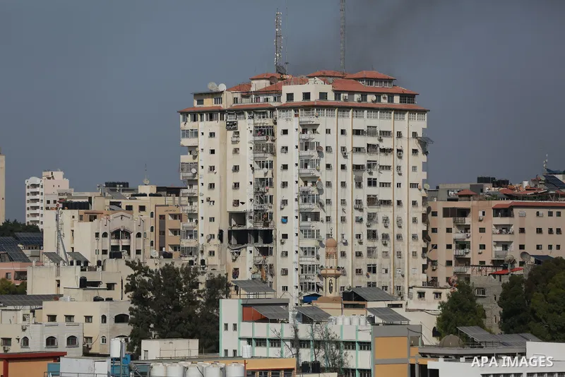 Smoke rises from a building following an Israeli air strike on Gaza City on August 5, 2022. The Israeli military said today it launched air strikes on Gaza, which were witnessed by Palestinians in central Gaza City. Phot...