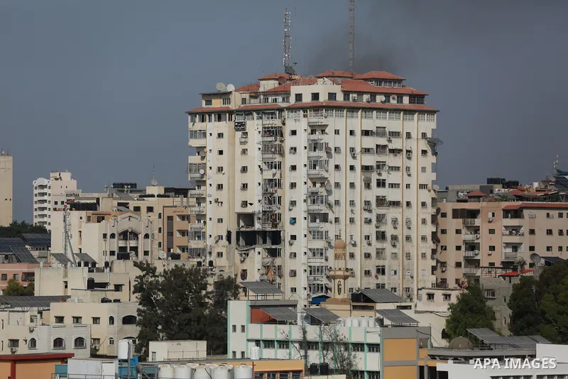 Smoke rises from a building following an Israeli air strike on Gaza City on August 5, 2022. The Israeli military said today it launched air strikes on Gaza, which were witnessed by Palestinians in central Gaza City. Phot...