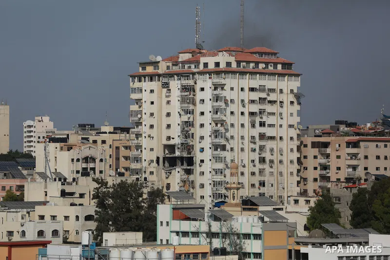 Smoke rises from a building following an Israeli air strike on Gaza City on August 5, 2022. The Israeli military said today it launched air strikes on Gaza, which were witnessed by Palestinians in central Gaza City. Phot...