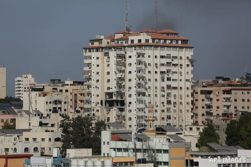 Smoke rises from a building following an Israeli air strike on Gaza City on August 5, 2022. The Israeli military said today it launched air strikes on Gaza, which were witnessed by Palestinians in central Gaza City. Phot...