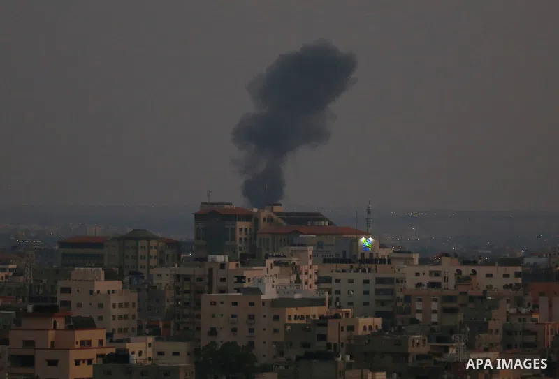 Smoke rises from a building following an Israeli air strike on Gaza City on August 5, 2022. The Israeli military said today it launched air strikes on Gaza, which were witnessed by Palestinians in central Gaza City. Phot...
