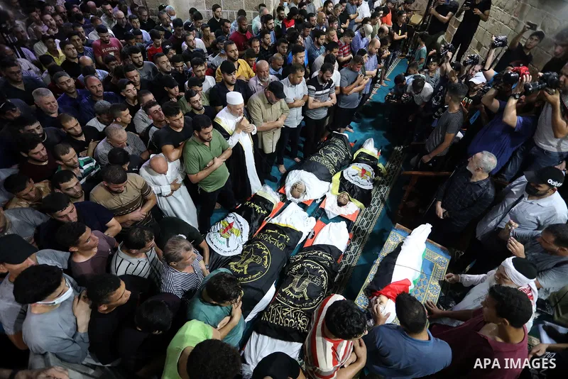 Palestinians attend the funeral of Islamic Jihad commander Tayseer al-Jabari who was killed in an Israeli air strike along with another Palestinians in Gaza City on August 5, 2022. The senior commander of Islamic Jihad w...