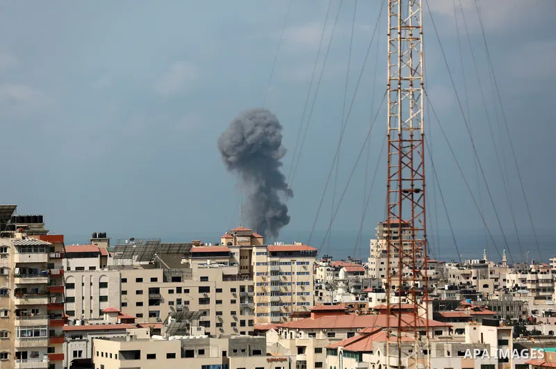Smoke rises from a building following an Israeli air strike on Gaza City on August 6, 2022. Photo by Bashar Taleb