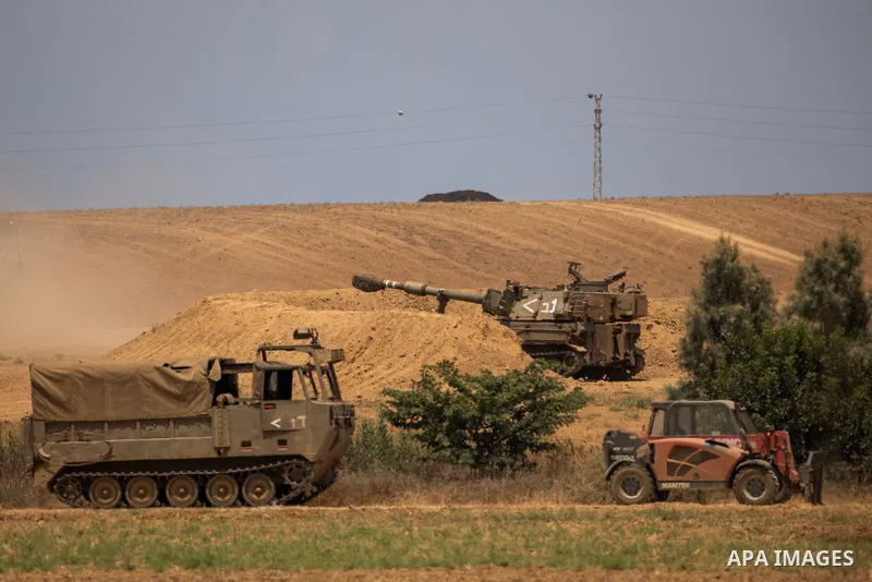 Israeli army artillery batteries are deployed at a position on the Israeli-Gaza border near Sderot 06 August 2022, Israel. The Israel Defence Forces said on Saturday they are preparing for a ''week of operations'' agains...