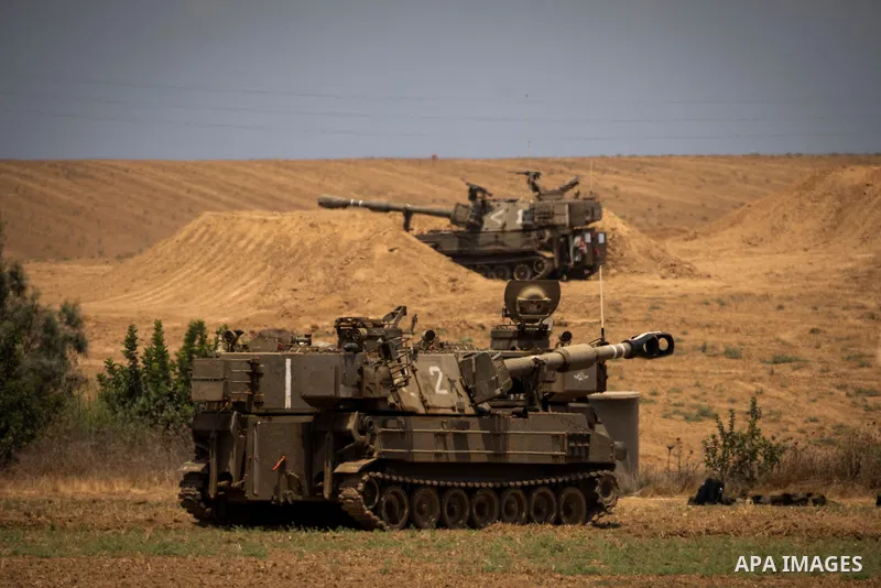 Israeli army artillery batteries are deployed at a position on the Israeli-Gaza border near Sderot 06 August 2022, Israel. The Israel Defence Forces said on Saturday they are preparing for a ''week of operations'' agains...