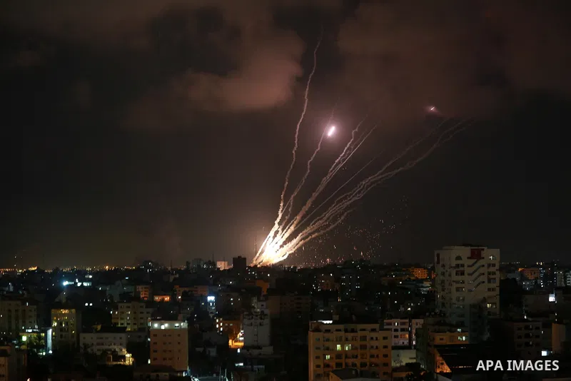 A salvo of rockets is fired from Gaza City toward Israel, on August 6, 2022. The Israeli military warned deadly aerial operations against militants in Gaza could last a week, as exchanges of fire were ongoing for a secon...
