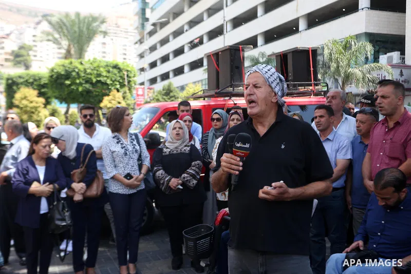 Palestinians take part in a protest in solidarity with the Gaza Strip, in the West Bank city of Nablus on August 7, 2022. The death toll from violence in Gaza has risen to 31, including six children, the health ministry...