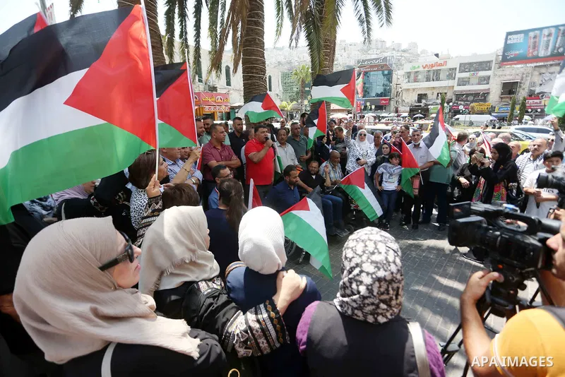 Palestinians take part in a protest in solidarity with the Gaza Strip, in the West Bank city of Nablus on August 7, 2022. The death toll from violence in Gaza has risen to 31, including six children, the health ministry...