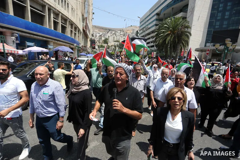 Palestinians take part in a protest in solidarity with the Gaza Strip, in the West Bank city of Nablus on August 7, 2022. The death toll from violence in Gaza has risen to 31, including six children, the health ministry...