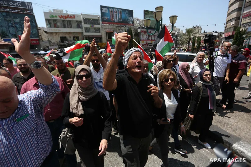 Palestinians take part in a protest in solidarity with the Gaza Strip, in the West Bank city of Nablus on August 7, 2022. The death toll from violence in Gaza has risen to 31, including six children, the health ministry...